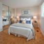 Taunton Terrace in Oshawa, ON large bedroom with hard surface flooring and mirrored closet Taunton Terrace in Oshawa, ON large bedroom with hard surface flooring and mirrored closet