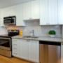 Taunton Terrace in Oshawa, ON modern kitchen with white cabinetry and stainless steel appliances Taunton Terrace in Oshawa, ON modern kitchen with white cabinetry and stainless steel appliances