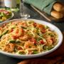 Shrimp Scampi: Lighter take on an Italian classic! Shrimp sautéed in a garlic sauce, tossed with asparagus, tomatoes and angel hair. Shrimp Scampi: Lighter take on an Italian classic! Shrimp sautéed in a garlic sauce, tossed with asparagus, tomatoes and angel hair.