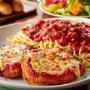 Chicken Parmigiana: A classic with our homemade marinara and a side of spaghetti. Chicken Parmigiana: A classic with our homemade marinara and a side of spaghetti.