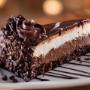 Black Tie Mousse Cake: Chocolate cake, dark chocolate cheesecake and creamy custard with icing. Black Tie Mousse Cake: Chocolate cake, dark chocolate cheesecake and creamy custard with icing.