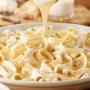 Fettuccine Alfredo: Our signature alfredo made fresh in-house every day, served over fettuccine. Fettuccine Alfredo: Our signature alfredo made fresh in-house every day, served over fettuccine.