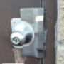 By adding a new plate and guard plate. This door has been rejuvenated and once again secured. By adding a new plate and guard plate. This door has been rejuvenated and once again secured.