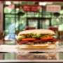 A Five Guys hot dog sits on the counter in a Five Guys restaurant. A Five Guys hot dog sits on the counter in a Five Guys restaurant.