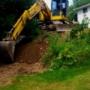 Equipment Operator Justin in the Komatsu waiting to load the truck with debris from a job in Fredericton filling in a pool. Equipment Operator Justin in the Komatsu waiting to load the truck with debris from a job in Fredericton filling in a pool.
