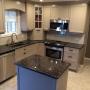 Sapphire Brown granite atop TRENDING Greige custom cabinets. Sapphire Brown granite atop TRENDING Greige custom cabinets.