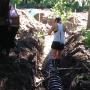 Raking in the first layer of soil on the infiltrators prior to back filling. Raking in the first layer of soil on the infiltrators prior to back filling.