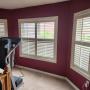 Direct Mount Vinyl Shutters with 2.5 Inch Louvers, Front Centre Tilt-Bar, Divider Rail, and Brass Hinges on Primary Bedroom Window in a Richmond Hill Home Direct Mount Vinyl Shutters with 2.5 Inch Louvers, Front Centre Tilt-Bar, Divider Rail, and Brass Hinges on Primary Bedroom Window in a Richmond Hill Home