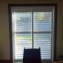 Framed Vinyl Shutters with By-Pass Track System on a Patio Door in a Richmond Hill Home Framed Vinyl Shutters with By-Pass Track System on a Patio Door in a Richmond Hill Home