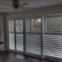 Maxxmar Vinyl Shutters with Open Bypass Track System on Sliding Patio Doors in a Thornhill Basement Workout Room Maxxmar Vinyl Shutters with Open Bypass Track System on Sliding Patio Doors in a Thornhill Basement Workout Room