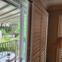 Vinyl Shutters with Bypass Track System and 3 1/2 Inch Louvers on a Patio Door in a Thornhill Home Vinyl Shutters with Bypass Track System and 3 1/2 Inch Louvers on a Patio Door in a Thornhill Home