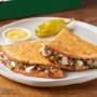 Parmesan crusted flatbread-style sandwich with Philly sauce, cheese, steak, onions and green peppers. Served with garlic dipping sauce. Parmesan crusted flatbread-style sandwich with Philly sauce, cheese, steak, onions and green peppers. Served with garlic dipping sauce.