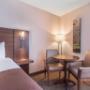 Guest room with table and chairs Guest room with table and chairs
