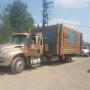 Bridge Lake Towing, flat deck, small shed hauling Bridge Lake Towing, flat deck, small shed hauling