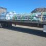 Flatbed hauling mass timber beams – Secure cross-border transport of construction materials. Flatbed hauling mass timber beams – Secure cross-border transport of construction materials.