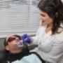 teeth whitening gel is brushed on to front teeth on client at Sault Ste. Marie office teeth whitening gel is brushed on to front teeth on client at Sault Ste. Marie office