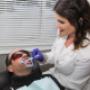 teeth whitening gel is brushed on to front teeth on client at Sault Ste. Marie office teeth whitening gel is brushed on to front teeth on client at Sault Ste. Marie office