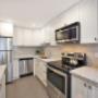 Modern kitchen with granite countertops and stainless steel appliances at 2300 Marine Drive Apartments in Oakville, ON Modern kitchen with granite countertops and stainless steel appliances at 2300 Marine Drive Apartments in Oakville, ON