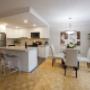 Open-concept kitchen with breakfast bar and dining area at 2300 Marine Drive Apartments in Oakville, ON Open-concept kitchen with breakfast bar and dining area at 2300 Marine Drive Apartments in Oakville, ON