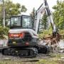 Bobcat E60 compact excavator performing demolition Bobcat E60 compact excavator performing demolition