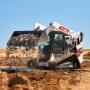 Bobcat T86 dumping and spreading rock with bucket Bobcat T86 dumping and spreading rock with bucket