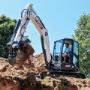 Bobcat E50 digging a trench Bobcat E50 digging a trench