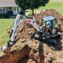Bobcat E50 compact excavator digging Bobcat E50 compact excavator digging