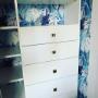 This customer really jazzed up her simple reach in custom closet by adding pretty wallpaper This customer really jazzed up her simple reach in custom closet by adding pretty wallpaper
