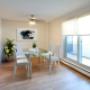 Spacious dining area with luxury vinyl plank flooring and balcony access at Regency Tower in Owen Sound, ON Spacious dining area with luxury vinyl plank flooring and balcony access at Regency Tower in Owen Sound, ON