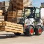 A Bobcat L28 small articulated loader with pallet fork attachment A Bobcat L28 small articulated loader with pallet fork attachment