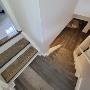 We installed vinyl throughout this customers' basement and landing. We then sanded the black painted stairs, stained them a custom colour to match the vinyl and applied 2 coats of polyurethane. We installed vinyl throughout this customers' basement and landing. We then sanded the black painted stairs, stained them a custom colour to match the vinyl and applied 2 coats of polyurethane.