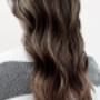 Balayage hair color transformation: Warm, sun-kissed highlights frame the face, creating a natural, dimensional look Balayage hair color transformation: Warm, sun-kissed highlights frame the face, creating a natural, dimensional look