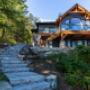 Flagstone staircase winds up to a beautiful Lake Muskoka home with classic timber frame details Flagstone staircase winds up to a beautiful Lake Muskoka home with classic timber frame details