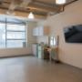 Large windows that let in ample natural light. Includes a prep area with a sink, overhead storage, a mint green mini fridge, a vanity station with lights, and a wall-mounted TV, ideal for beauty shoots, video content, or client prep space. Large windows that let in ample natural light. Includes a prep area with a sink, overhead storage, a mint green mini fridge, a vanity station with lights, and a wall-mounted TV, ideal for beauty shoots, video content, or client prep space.