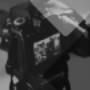 Close-up of a DSLR camera with a viewfinder screen showing a group photo. The image features geometric overlays in grayscale, ideal as a banner or cover image for photography services. Close-up of a DSLR camera with a viewfinder screen showing a group photo. The image features geometric overlays in grayscale, ideal as a banner or cover image for photography services.