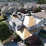 Aerial view of an in-progress residential roofing project by AlphaNova Roofing. The home is partially covered with IKO underlayment as the crew prepares the roof deck for shingle installation. Aerial view of an in-progress residential roofing project by AlphaNova Roofing. The home is partially covered with IKO underlayment as the crew prepares the roof deck for shingle installation.